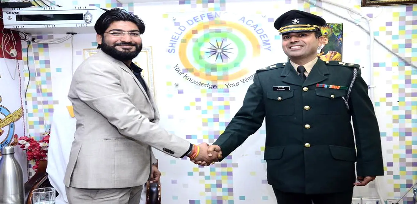 Academy representative and Army officer handshake